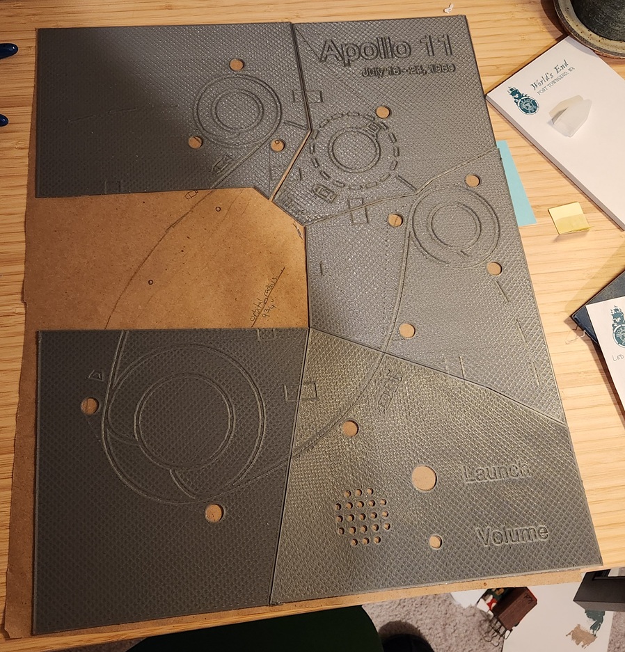 Five of the six pieces together, laid atop a paper diagram.